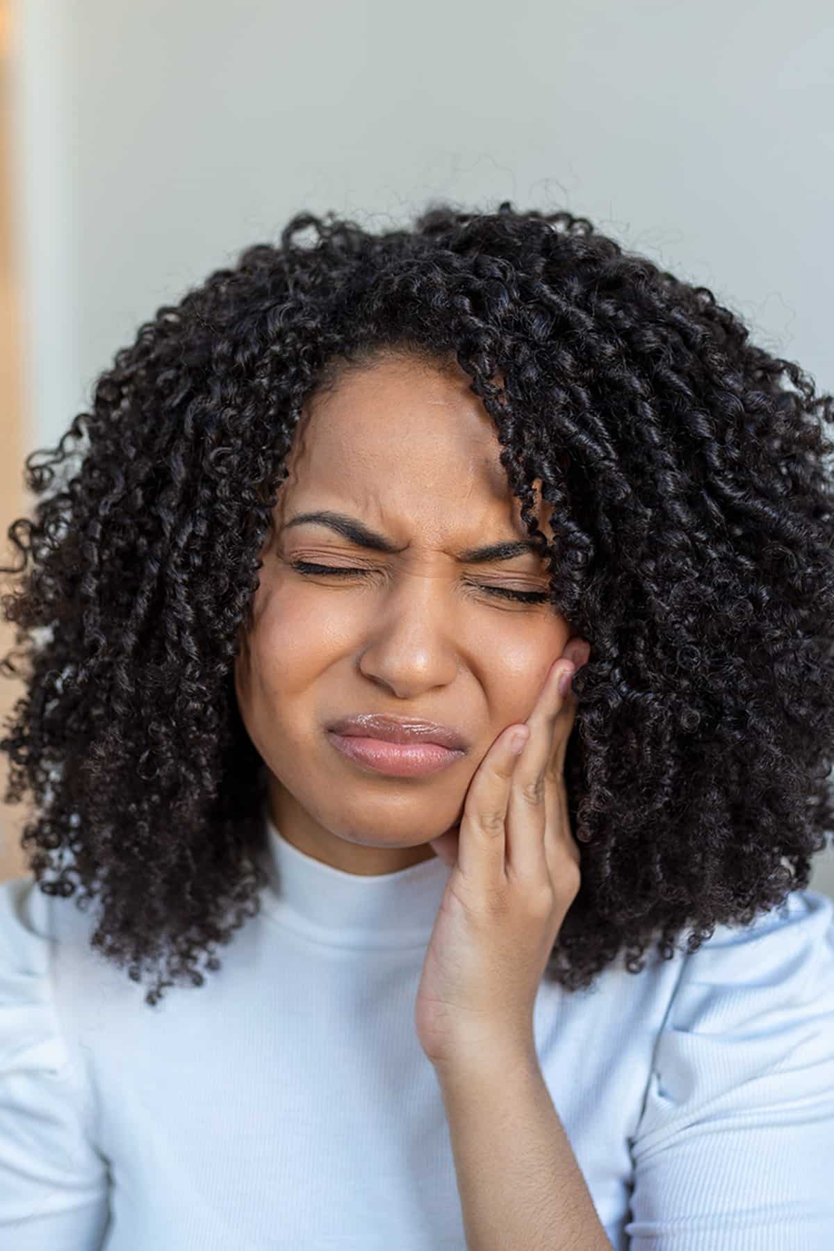 A young woman having a dental exam preformed AT esteem dental studio