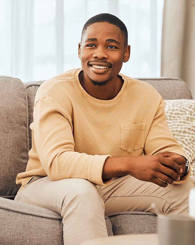 A young woman laying down in a dental chair smiling at esteem dental studio