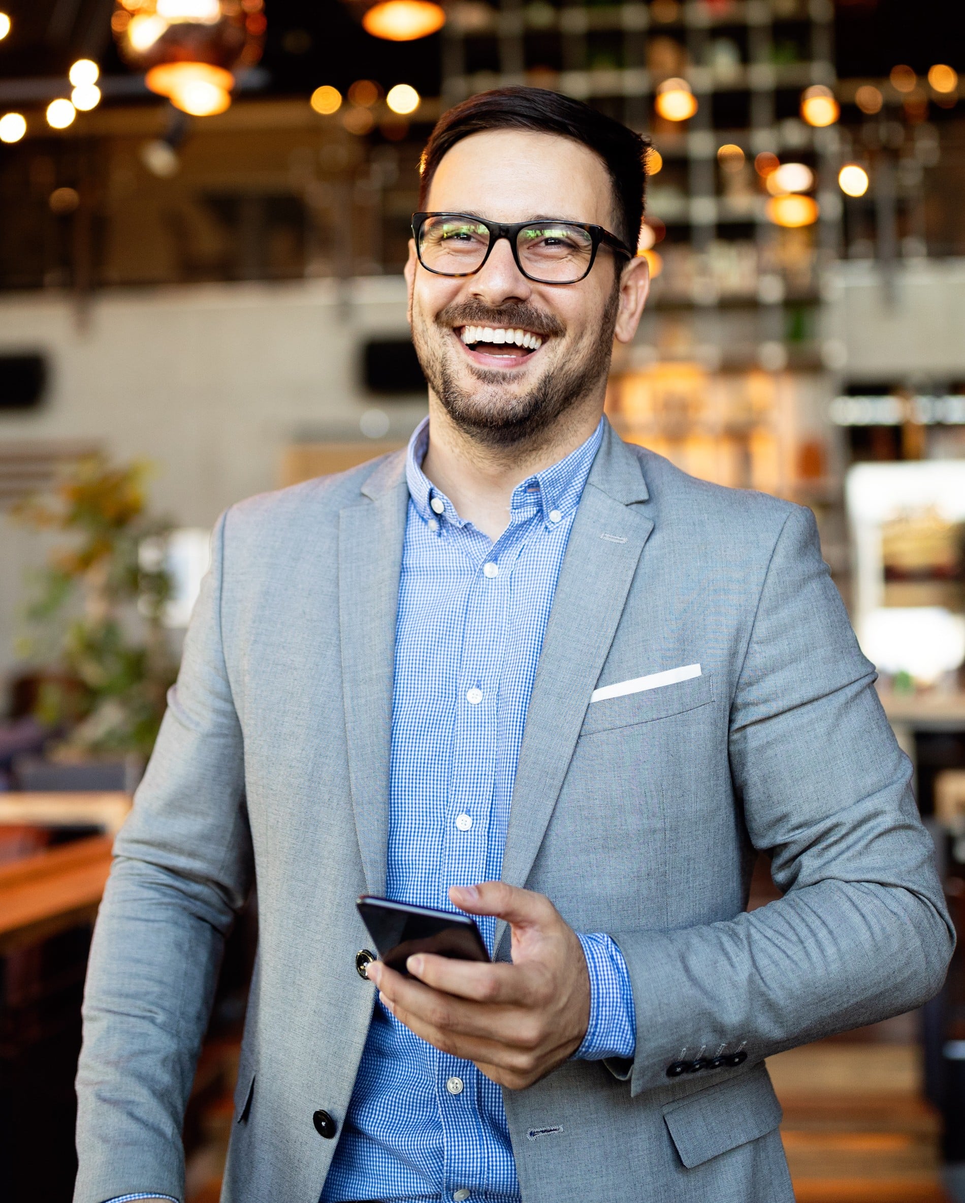 A young woman laying down in a dental chair smiling at esteem dental studio