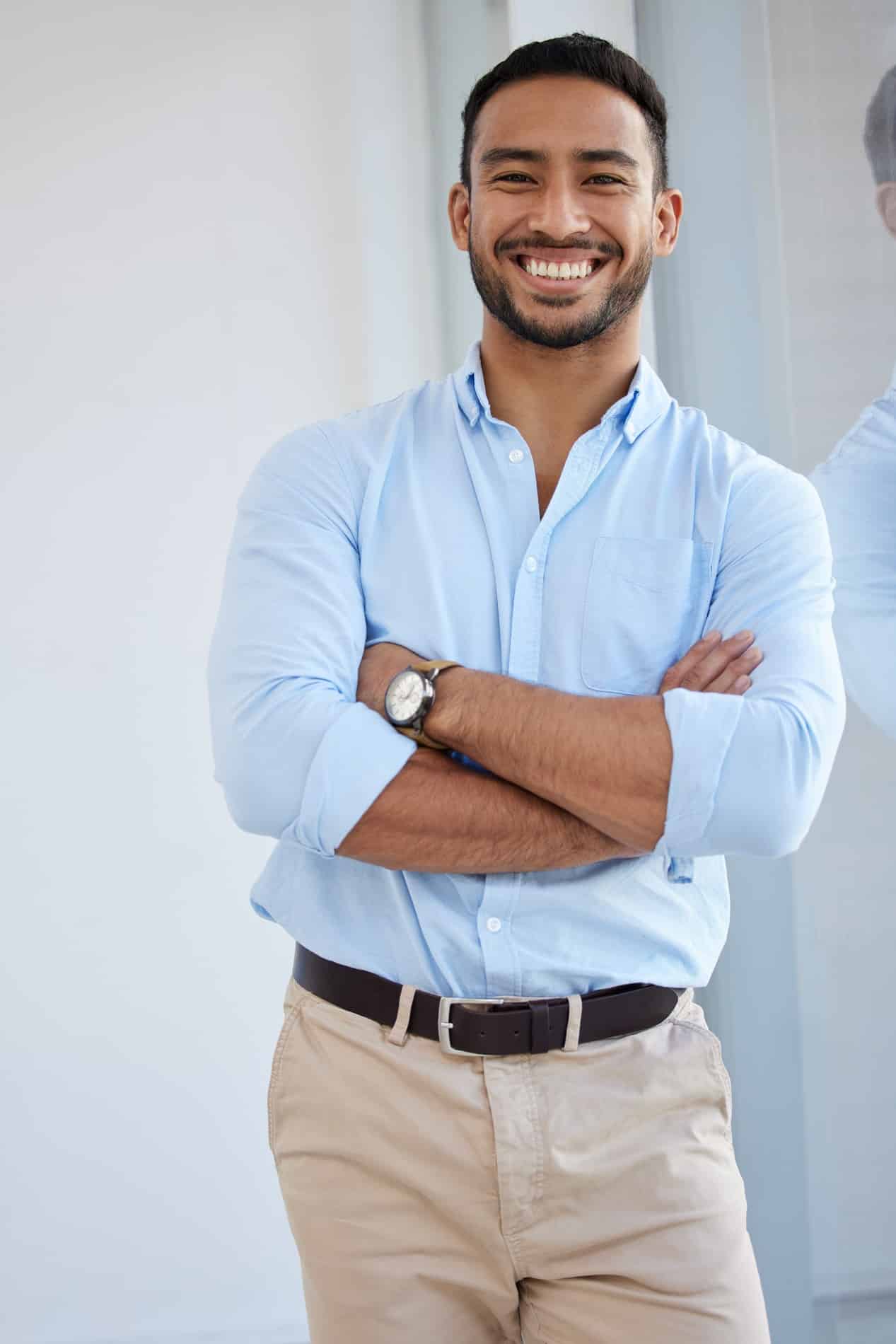 A young woman laying down in a dental chair smiling at esteem dental studio