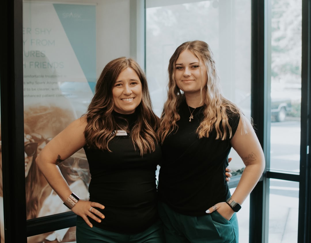 A young woman smiling with her eyes closed in powder springs ga