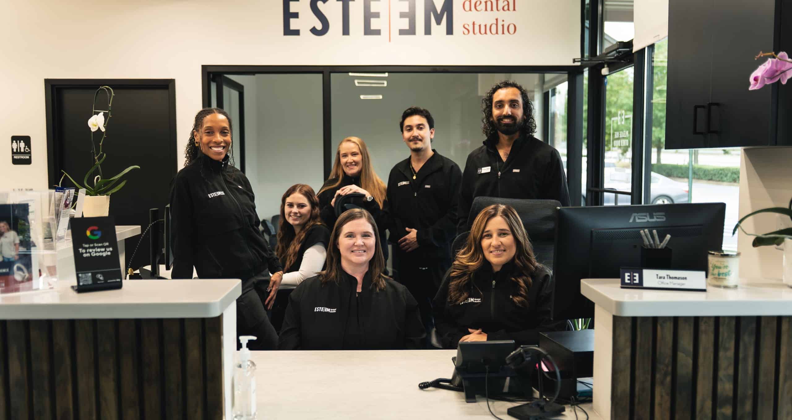 Reception of modern office with lights and wood on the ceiling