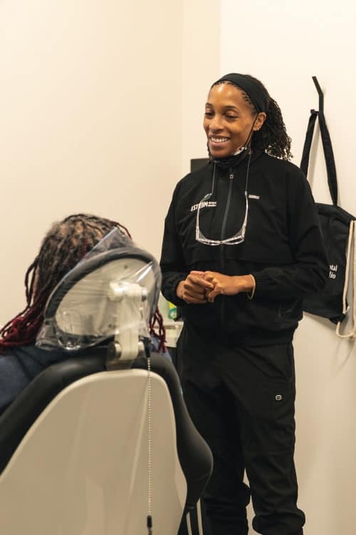 A group of older adults outside during a sunset, smiling and laughing together in powder springs ga