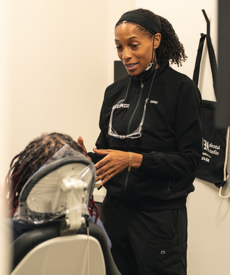 A young woman having a dental exam preformed AT esteem dental studio