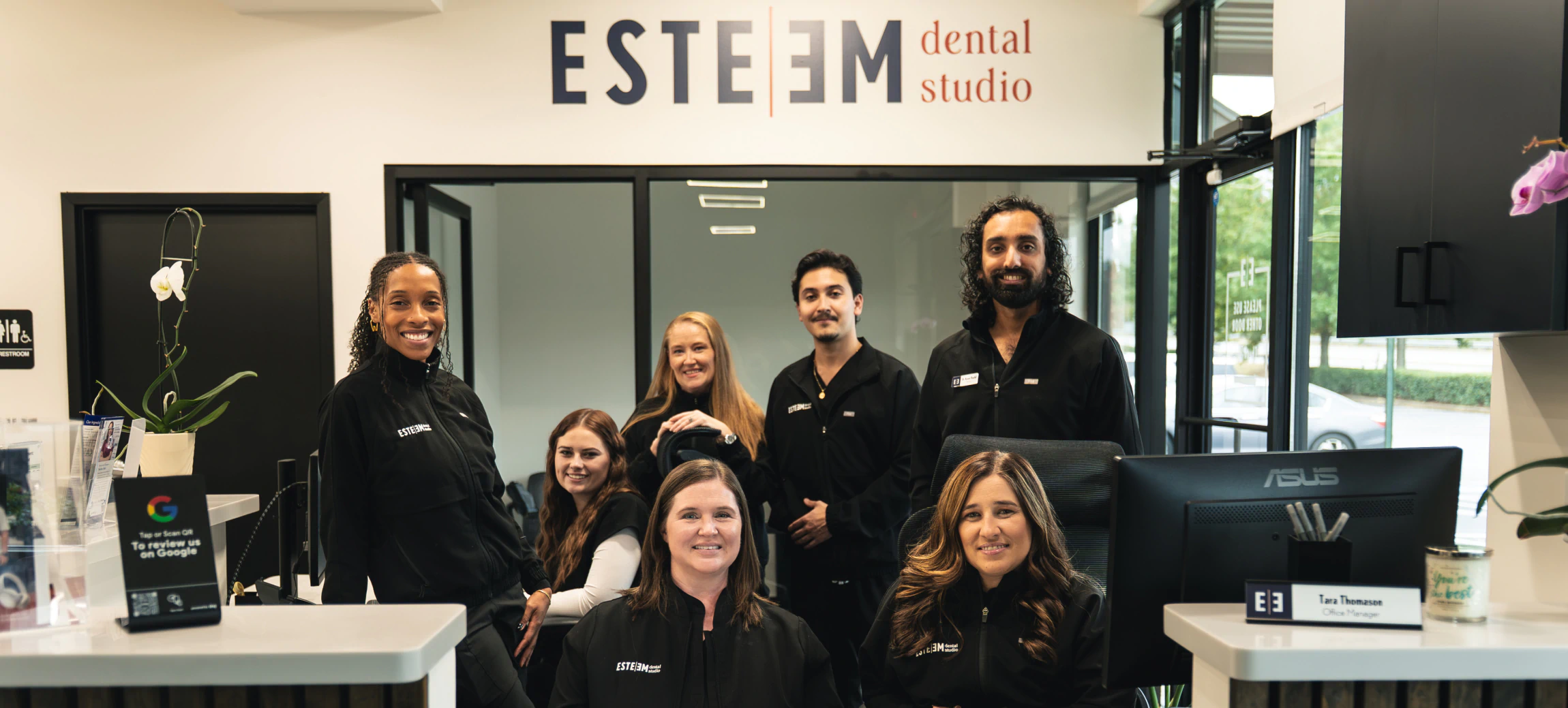Reception of modern office with lights and wood on the ceiling