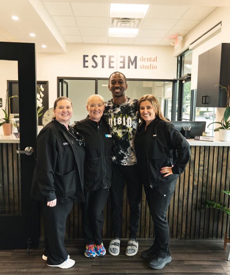 A young woman having a dental exam preformed AT esteem dental studio