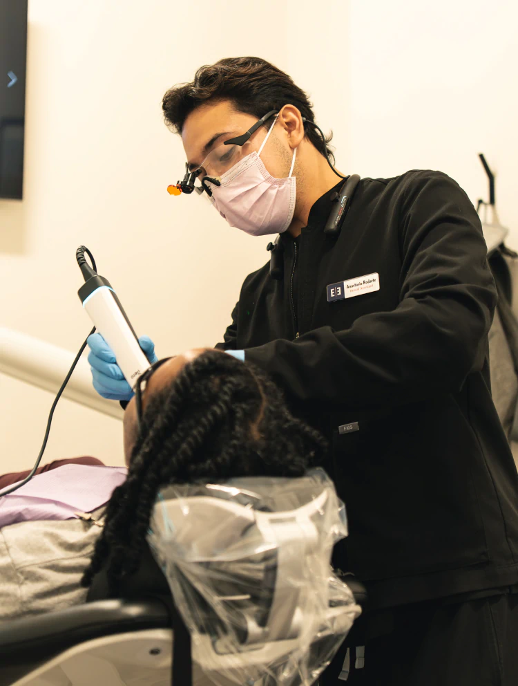 A man smiling and brushing his teeth in powder springs gA