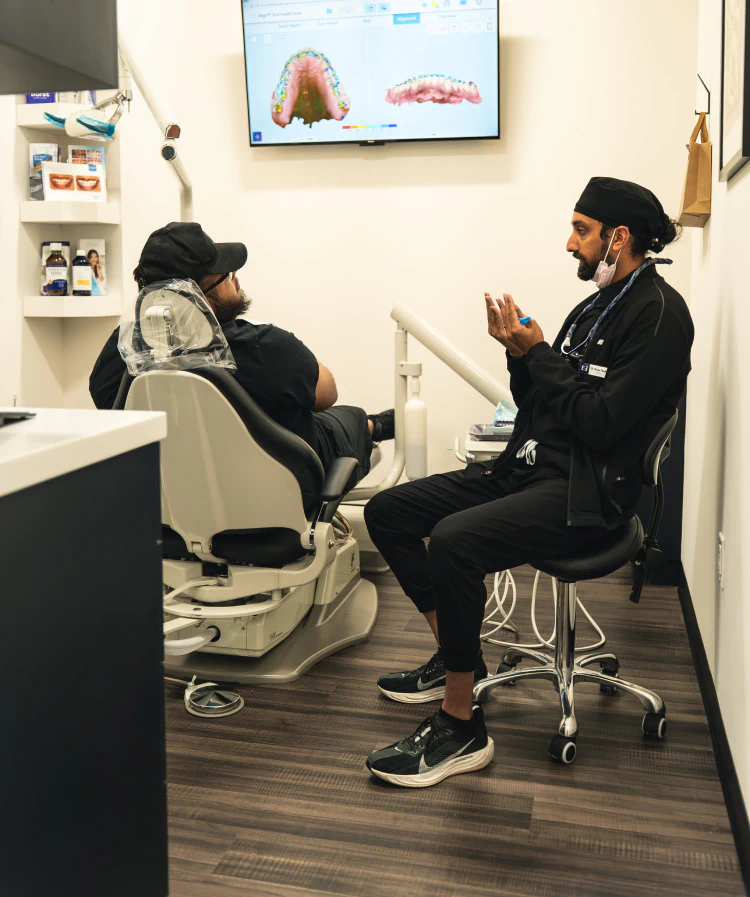 A young woman having a dental exam preformed AT esteem dental studio