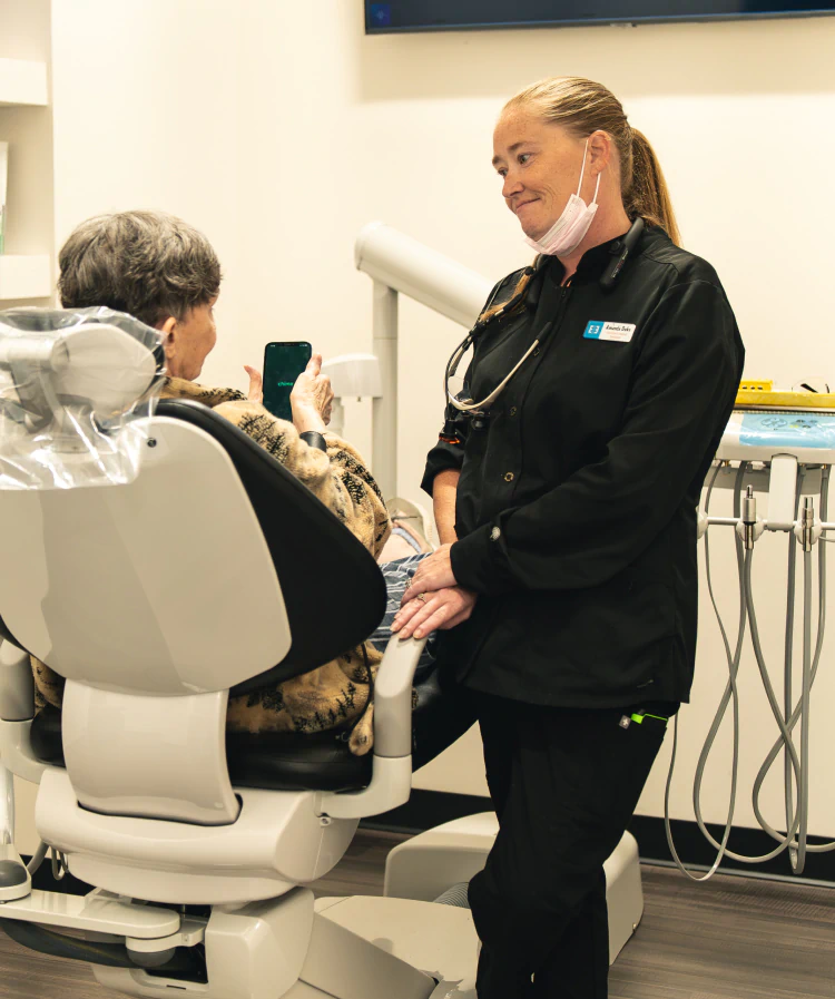 A young woman having a dental exam preformed AT esteem dental studio