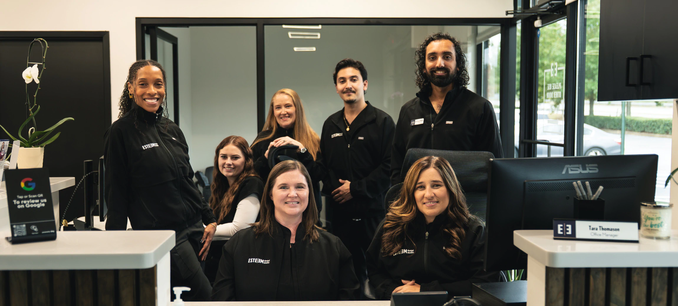 Reception of modern office with lights and wood on the ceiling